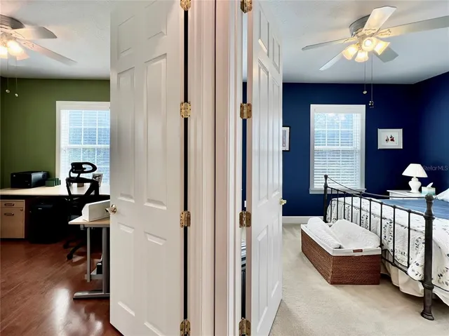 a bedroom with furniture and a window