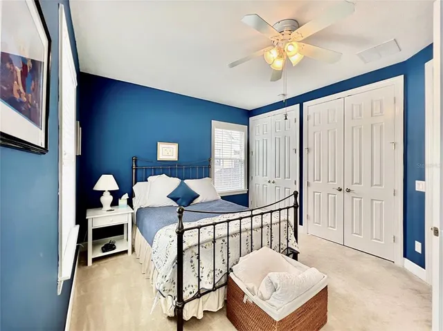 a bedroom with furniture and a chandelier