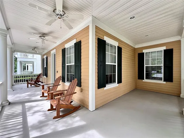 a view of a patio with table and chairs