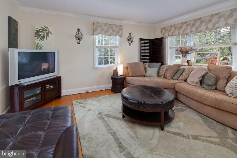 418 Overbrook Road Baltimore, MD 21212 - Photo 2 of 30 a living room with furniture a flat screen tv and a fireplace
