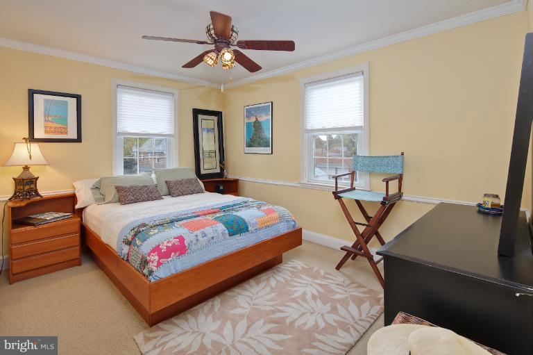 418 Overbrook Road Baltimore, MD 21212 - Photo 13 of 30 a bedroom with a bed a window and couch