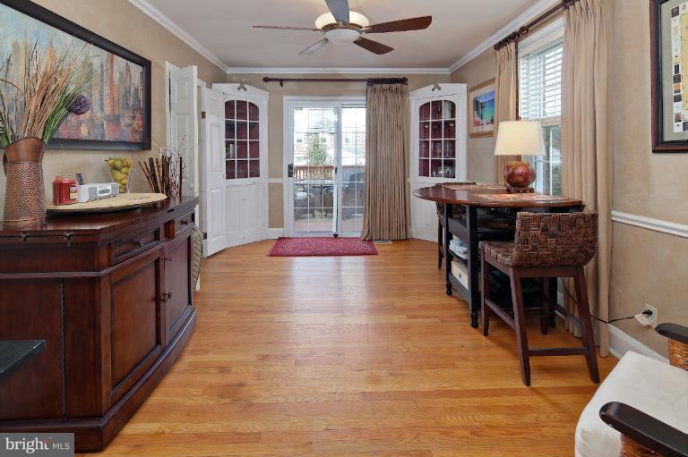 418 Overbrook Road Baltimore, MD 21212 - Photo 19 of 30 a dining room with wooden floor and a window