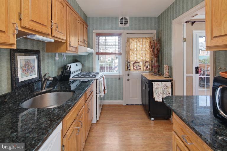 418 Overbrook Road Baltimore, MD 21212 - Photo 20 of 30 a kitchen with granite countertop a sink and a stove