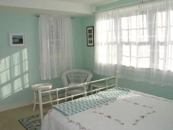 a bathroom with a bathtub and window
