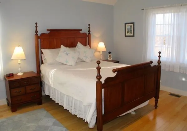 a bed room with a bed and a lamp