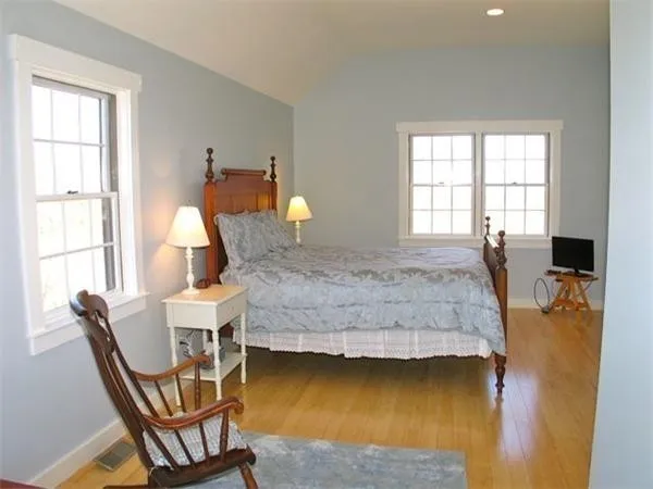 a bedroom with a bed and window