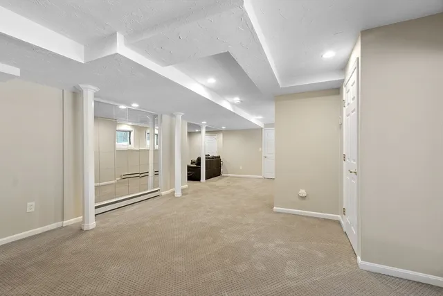 an empty room with windows and pillars in it