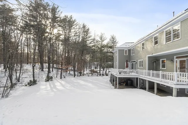 a swimming pool with outdoor seating and yard