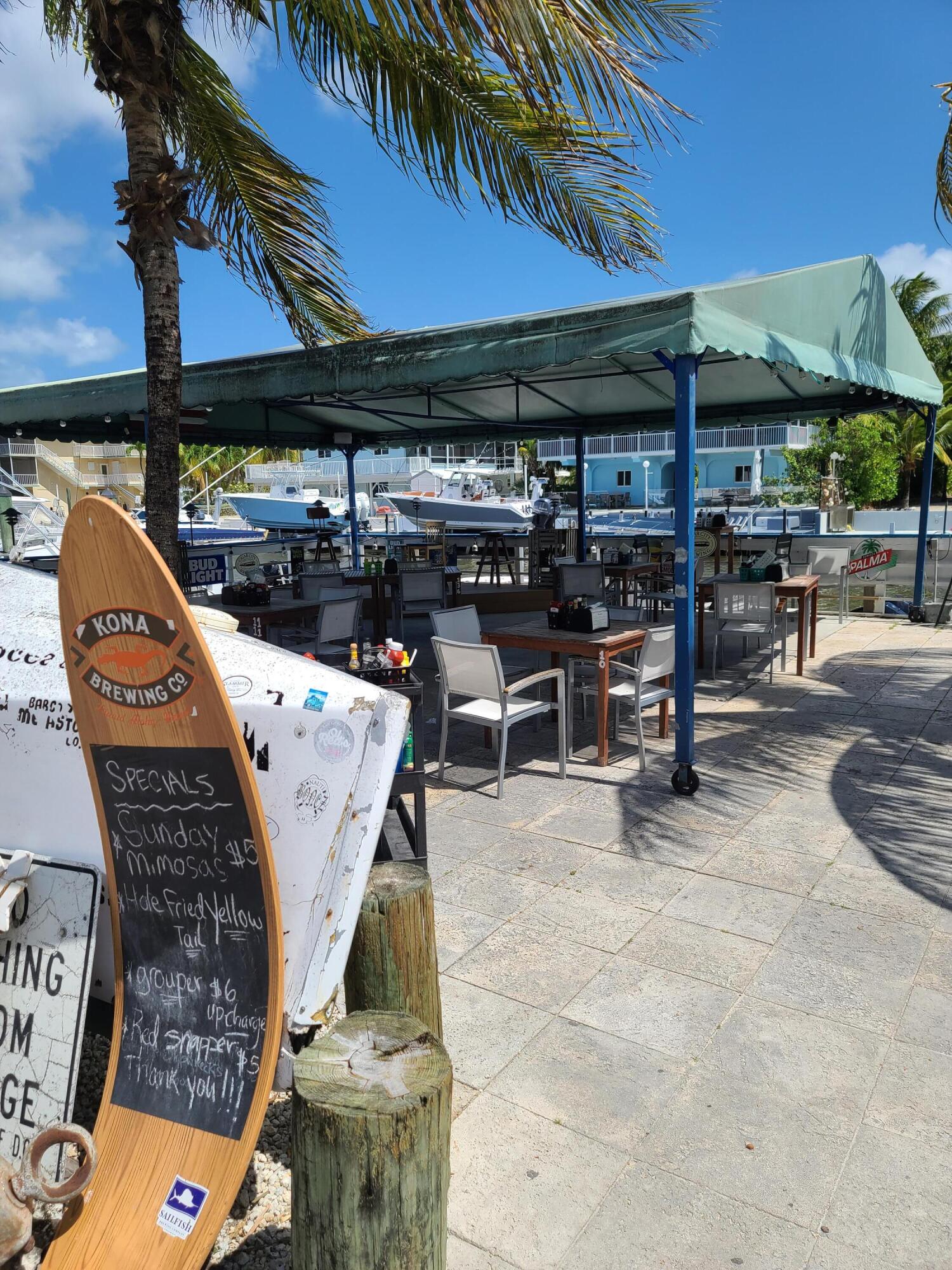 14 South Exuma Road Key Largo, FL 33037 - Photo 13 of 32 an outdoor space with seating