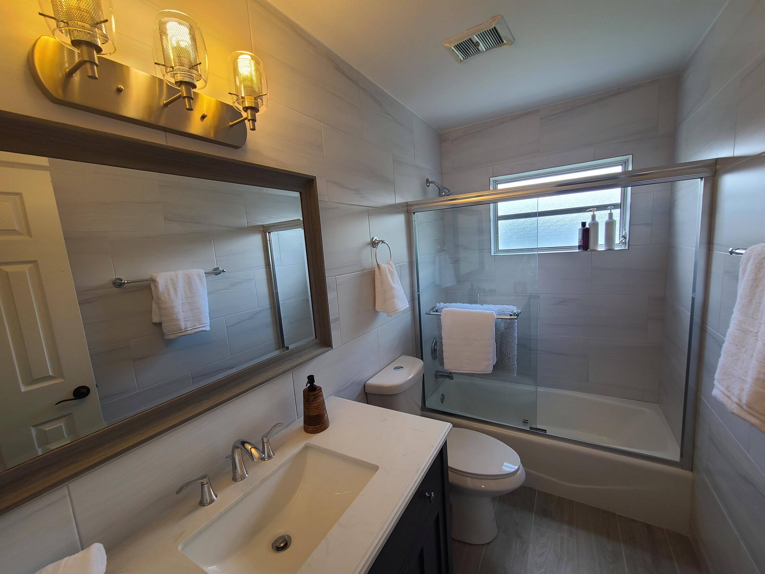 14 South Exuma Road Key Largo, FL 33037 - Photo 22 of 32 a bathroom with a sink a toilet and shower