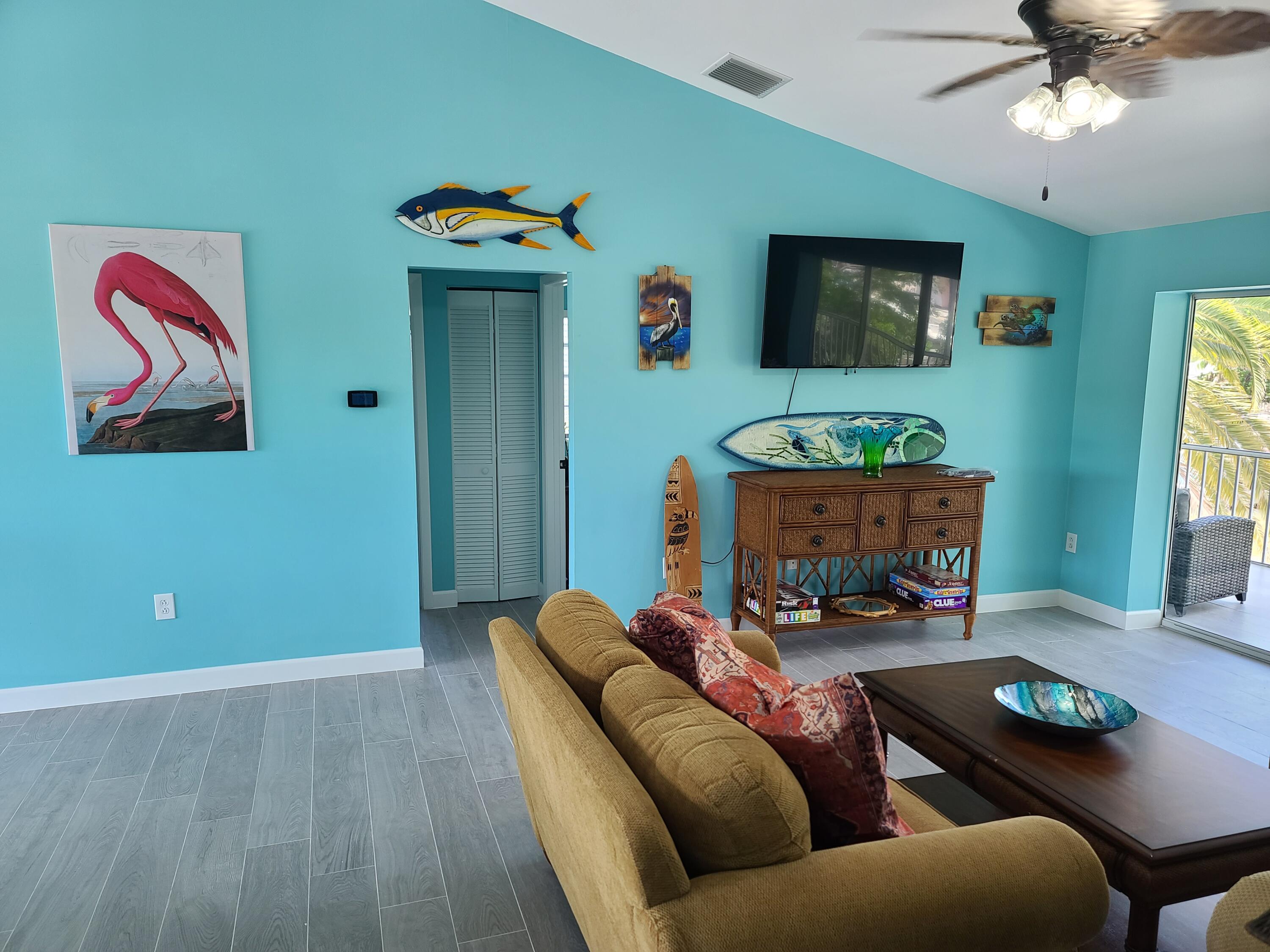 14 South Exuma Road Key Largo, FL 33037 - Photo 5 of 32 a living room with furniture and a flat screen tv