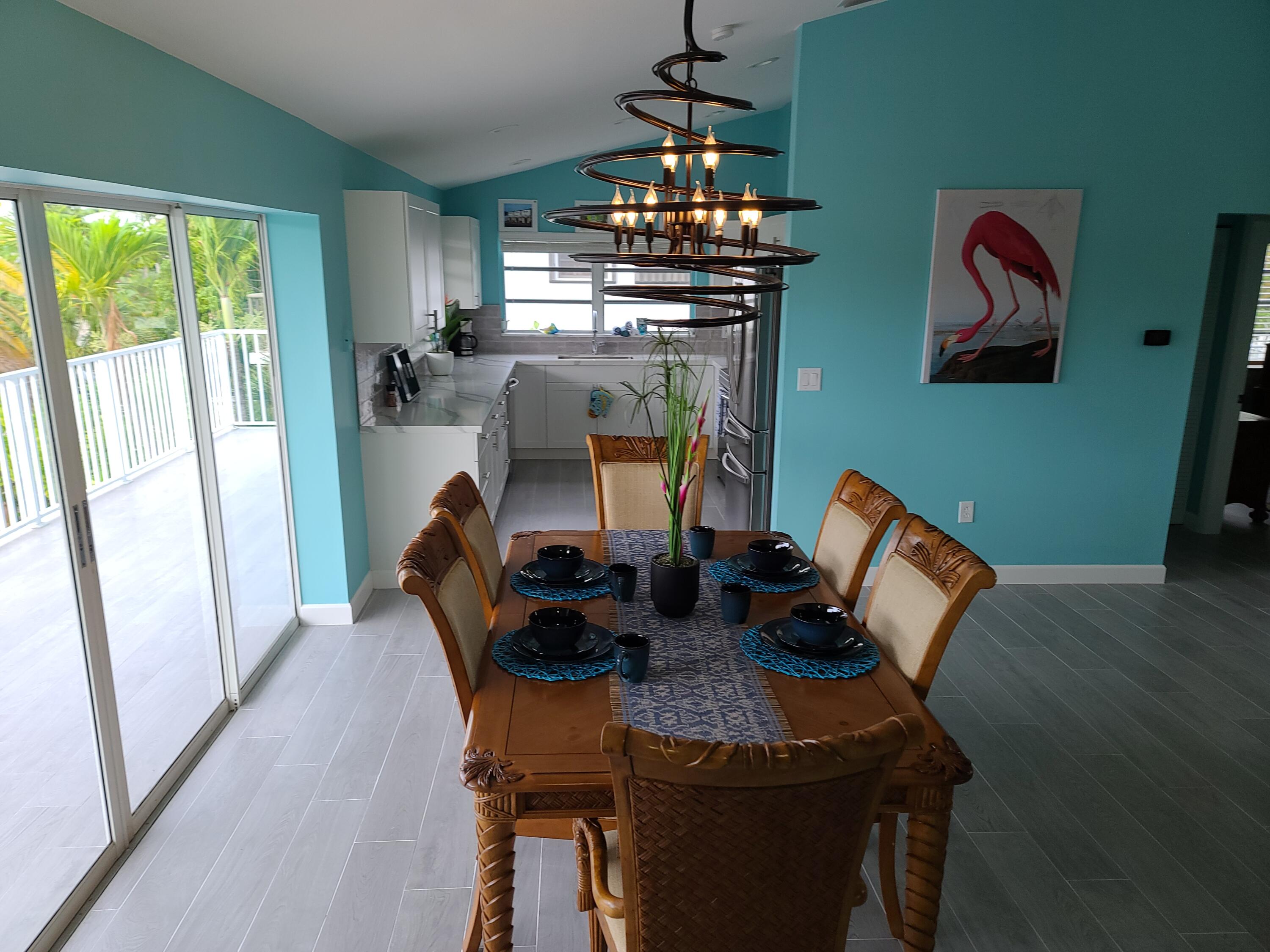 14 South Exuma Road Key Largo, FL 33037 - Photo 10 of 32 a view of a dining room with furniture window and outside view