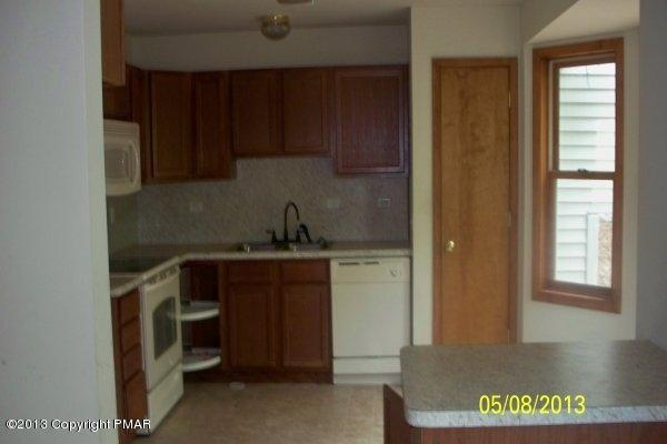 662 Edinburgh Road Bushkill, PA 18324 - Photo 3 of 7 a kitchen with a refrigerator and window