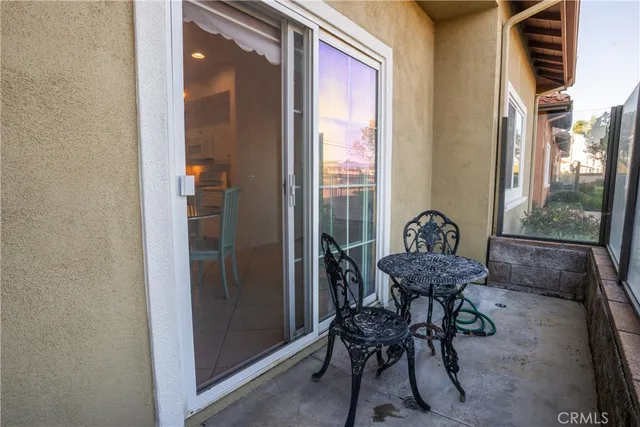 a view of a room with furniture and wooden floor