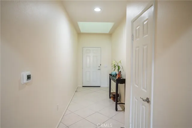 a view of a hallway to rooms