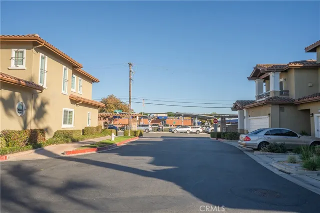 a city street lined with buildings and cars