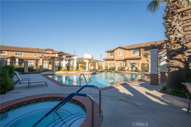 a view of a swimming pool with a patio