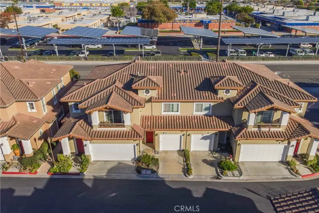 an aerial view of a house with a garden and plants