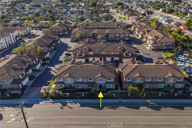 an aerial view of a building with street