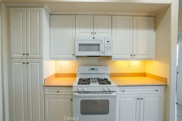 a kitchen with a stove and a sink