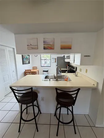 a kitchen with a stove and a cabinets