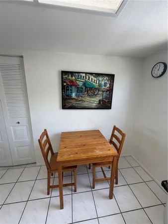 a view of a room with furniture and wooden floor