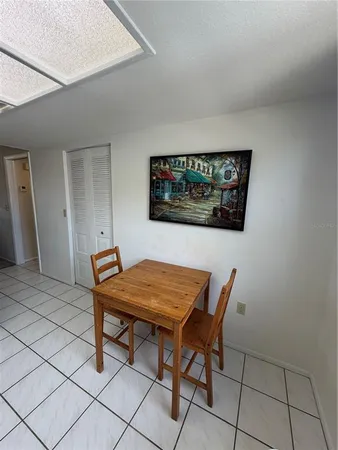 a view of a room with furniture and wooden floor
