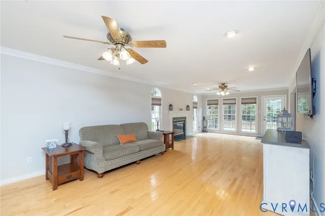 a spacious bedroom with a bed and a flat screen tv