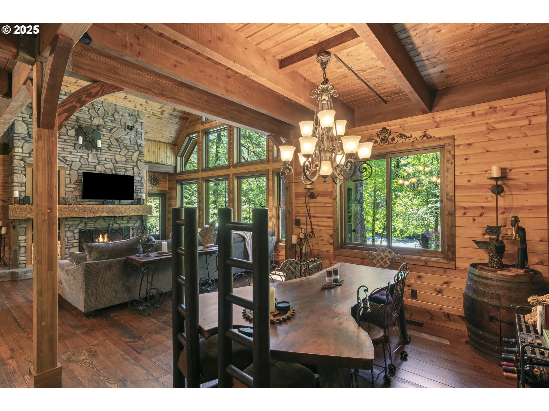 55590 McKenzie River Drive Blue River, OR 97413 - Photo 13 of 45 a view of a dining room with furniture window and outside view