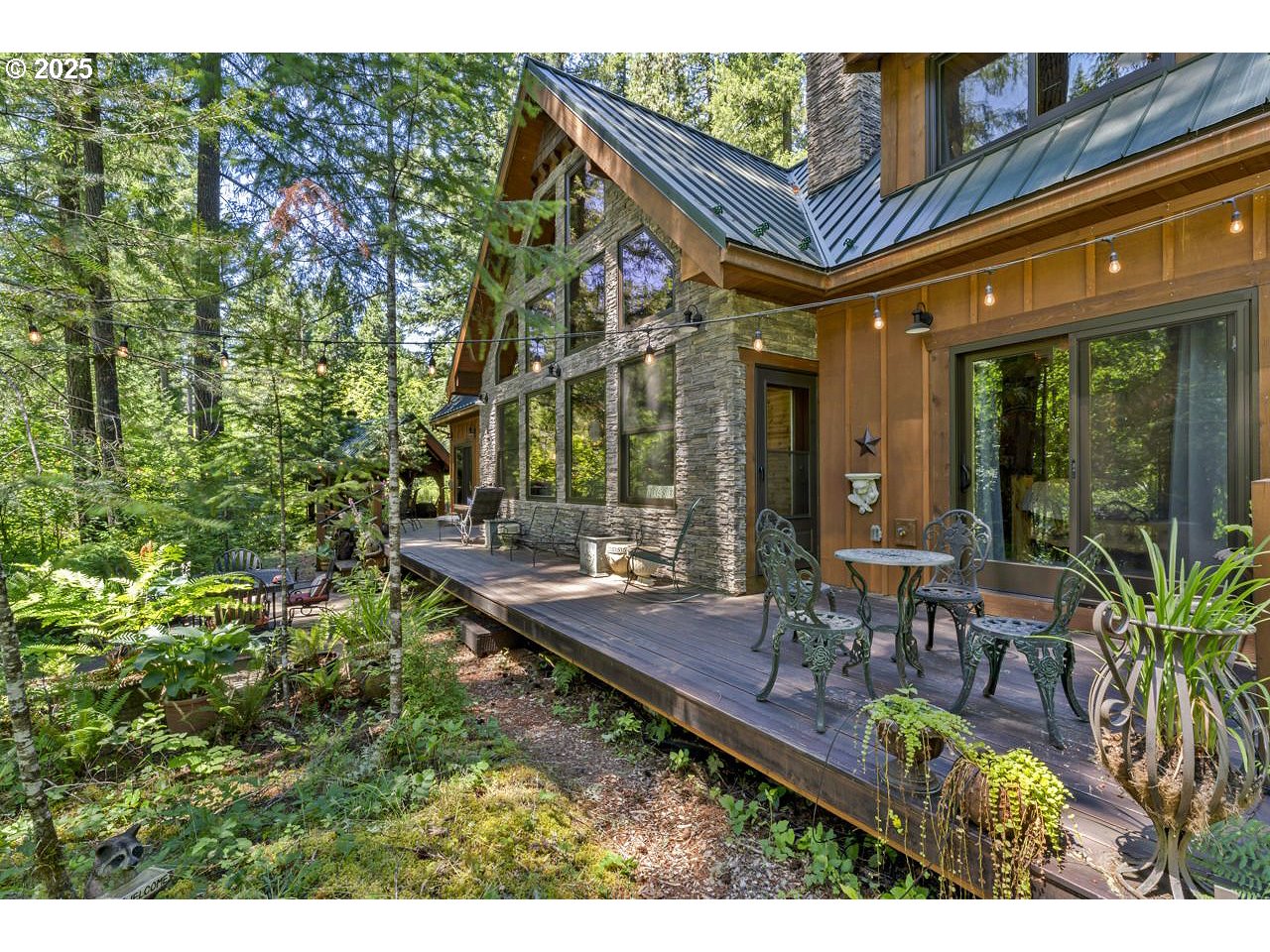 55590 McKenzie River Drive Blue River, OR 97413 - Photo 16 of 45 a view of a chairs and table in a patio