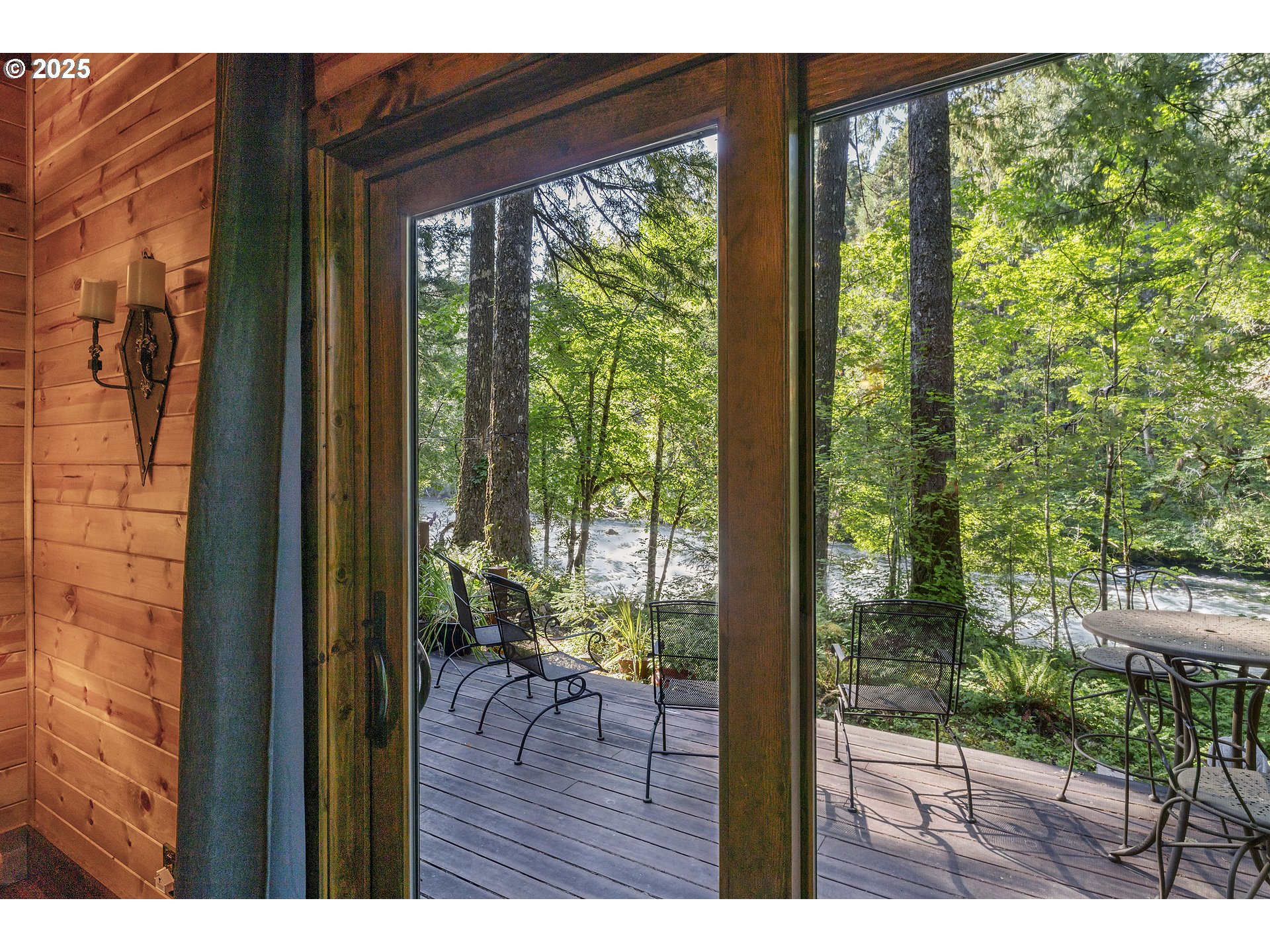 55590 McKenzie River Drive Blue River, OR 97413 - Photo 27 of 45 a view of a porch and backyard