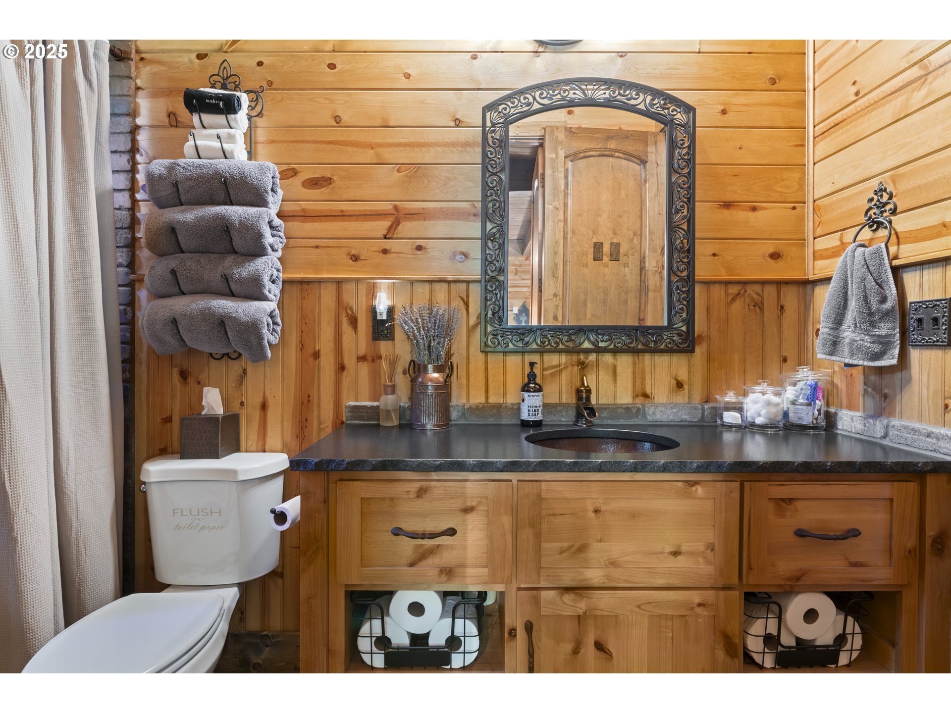 55590 McKenzie River Drive Blue River, OR 97413 - Photo 28 of 45 a bathroom with a sink mirror vanity and toilet