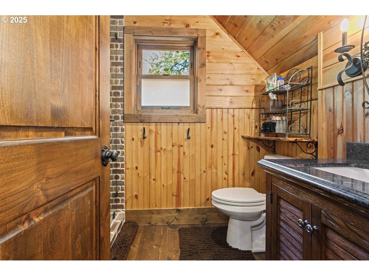 55590 McKenzie River Drive Blue River, OR 97413 - Photo 32 of 45 a bathroom with a granite countertop sink toilet and shower