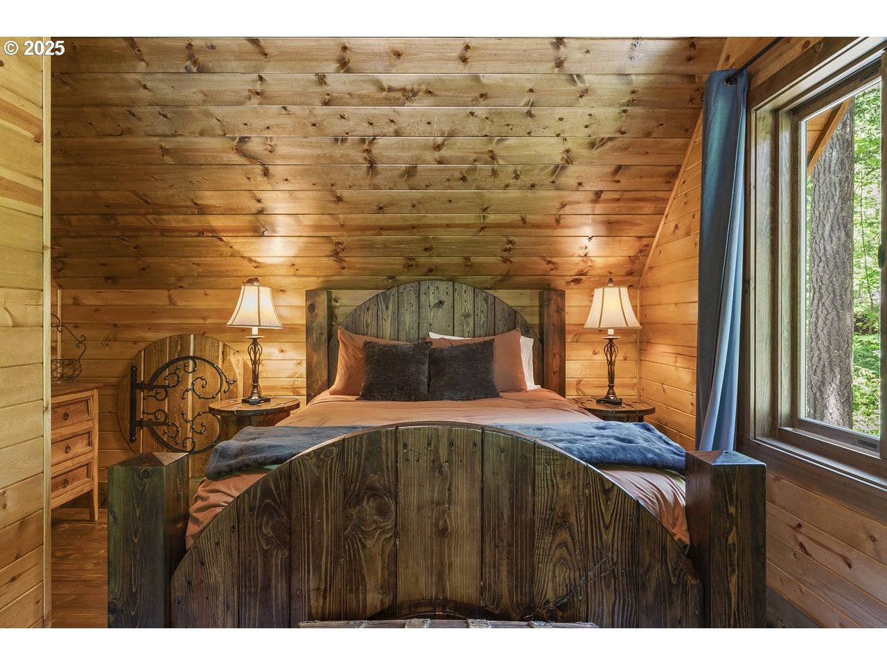 55590 McKenzie River Drive Blue River, OR 97413 - Photo 37 of 45 a bedroom with a bed and a window