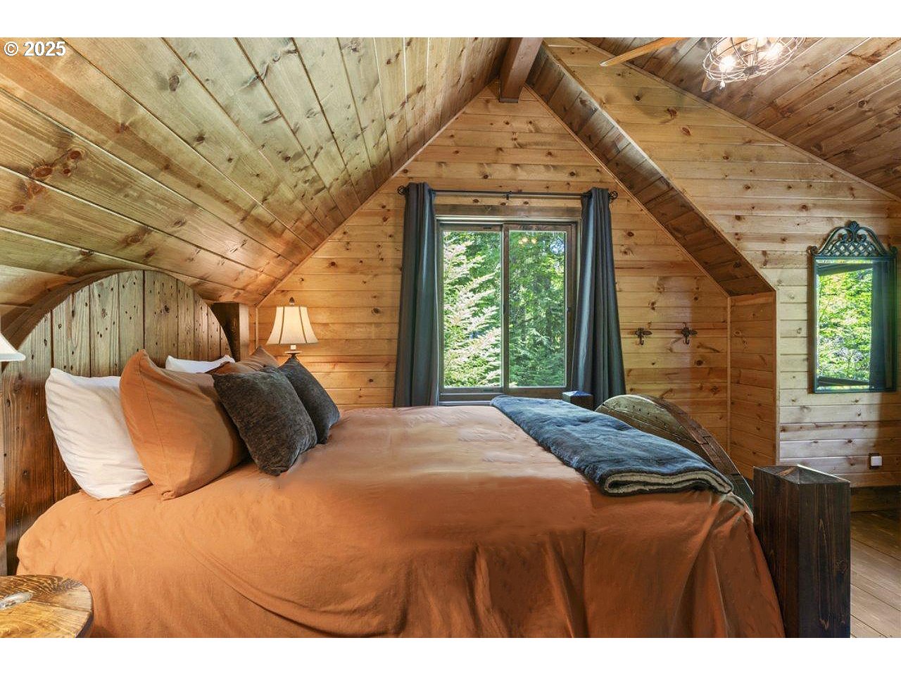 55590 McKenzie River Drive Blue River, OR 97413 - Photo 38 of 45 a bedroom with a bed and a window