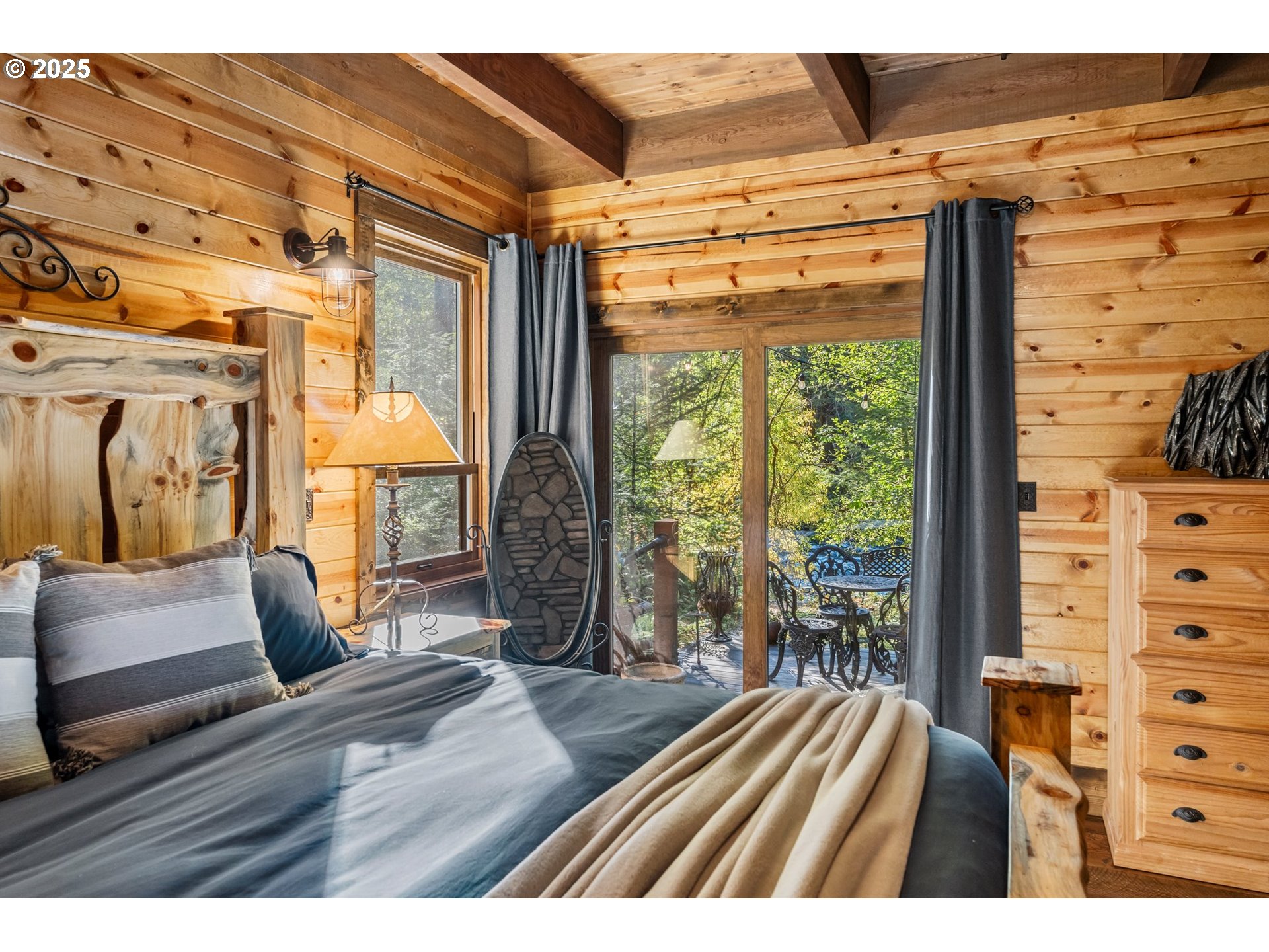 55590 McKenzie River Drive Blue River, OR 97413 - Photo 7 of 45 a bedroom with furniture and a large window