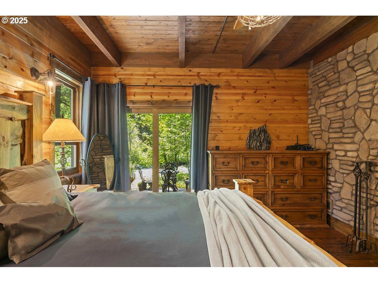 55590 McKenzie River Drive Blue River, OR 97413 - Photo 8 of 45 a view of a living room and balcony