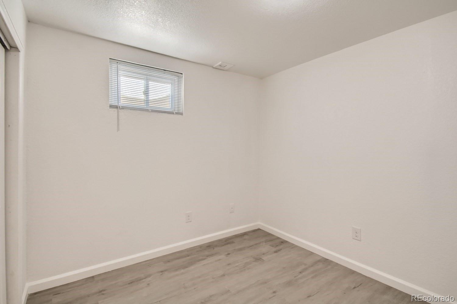 7480 Wolff Street Westminster, CO 80030 - Photo 11 of 16 wooden floor in an empty room