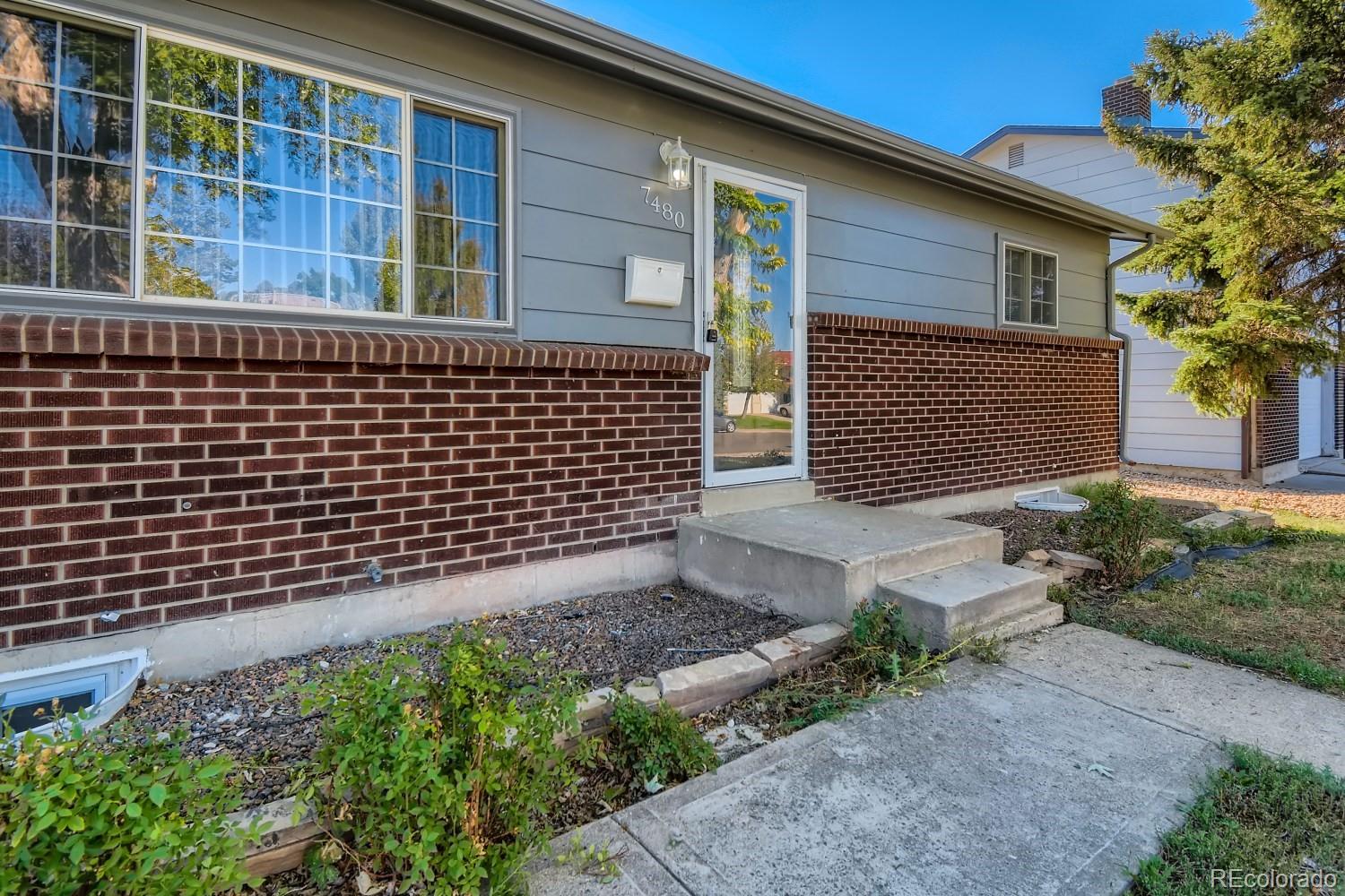 7480 Wolff Street Westminster, CO 80030 - Photo 3 of 16 a backyard of a house
