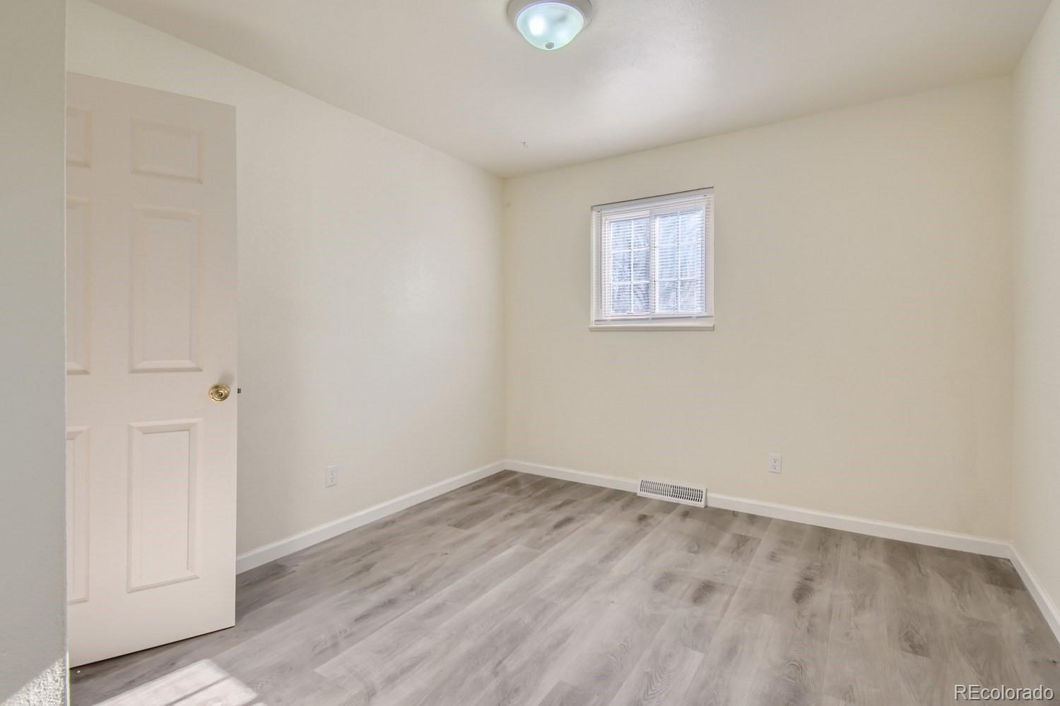 7480 Wolff Street Westminster, CO 80030 - Photo 6 of 16 wooden floor in an empty room