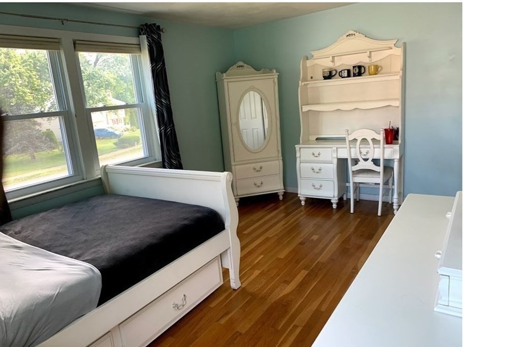 12 Burning Tree Road Natick, MA 01760 - Photo 16 of 34 a living room with furniture and a fireplace
