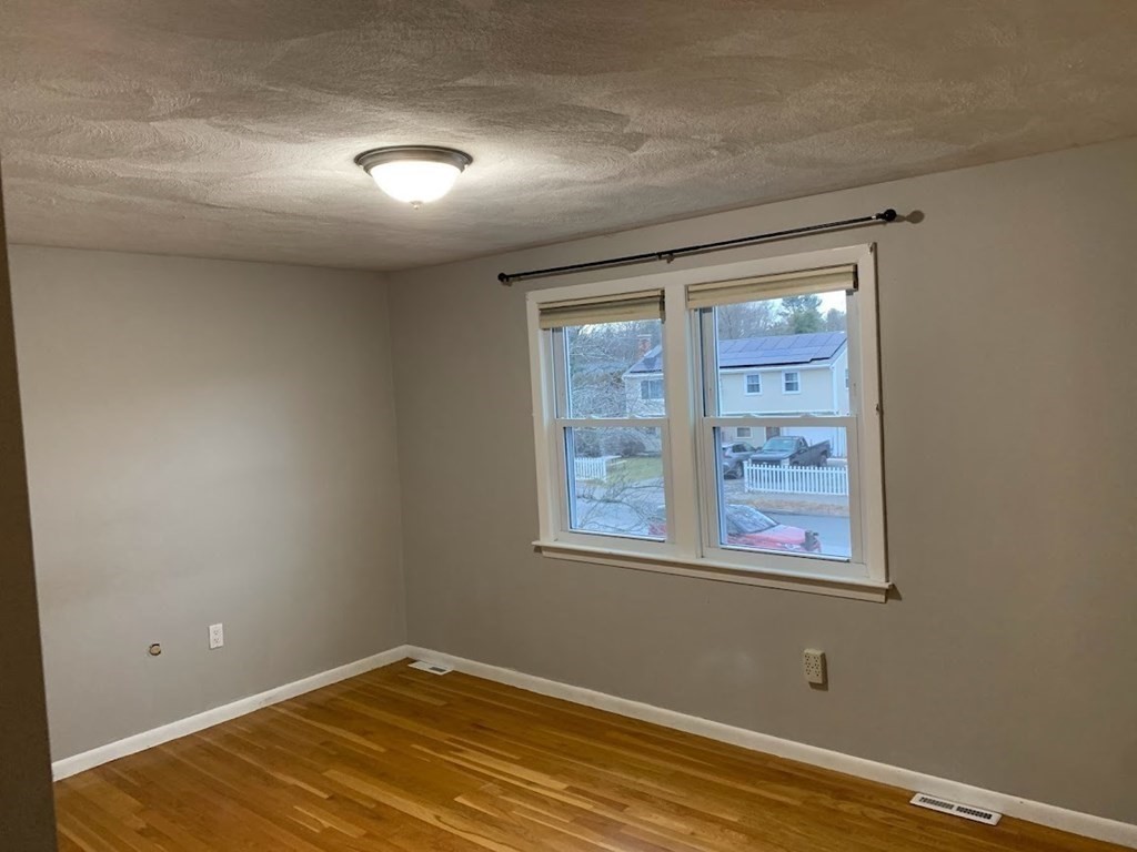 12 Burning Tree Road Natick, MA 01760 - Photo 17 of 34 an empty room with a window