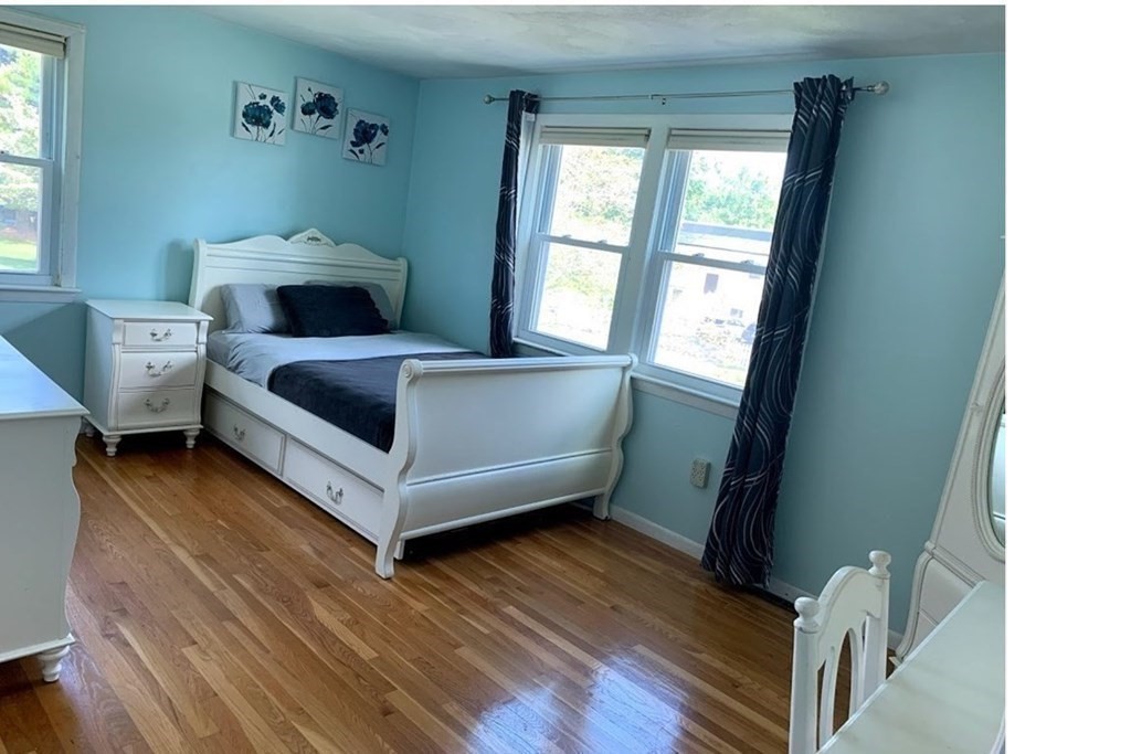 12 Burning Tree Road Natick, MA 01760 - Photo 18 of 34 a living room with furniture and a window