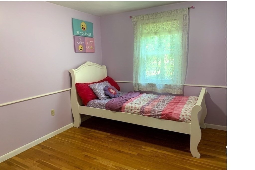 12 Burning Tree Road Natick, MA 01760 - Photo 24 of 34 a bedroom with a bed and a window