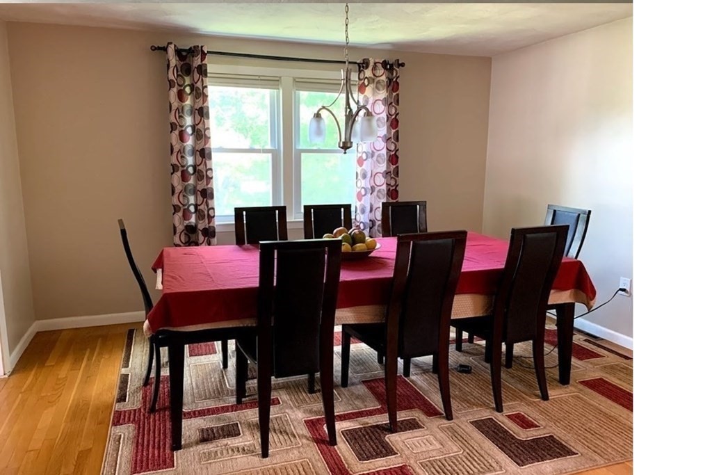 12 Burning Tree Road Natick, MA 01760 - Photo 6 of 34 a view of a dining room with furniture and window