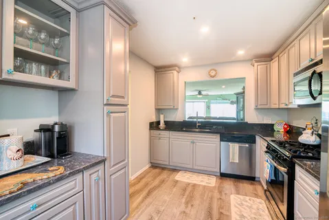 a kitchen with a stove and a microwave