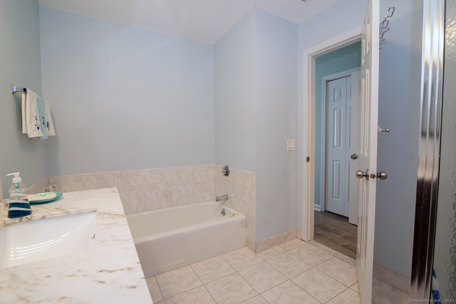 1 Mansfield Grove Road, Unit 306 East Haven, CT 06512 - Photo 16 of 31 a bathroom with a bathtub and a shower