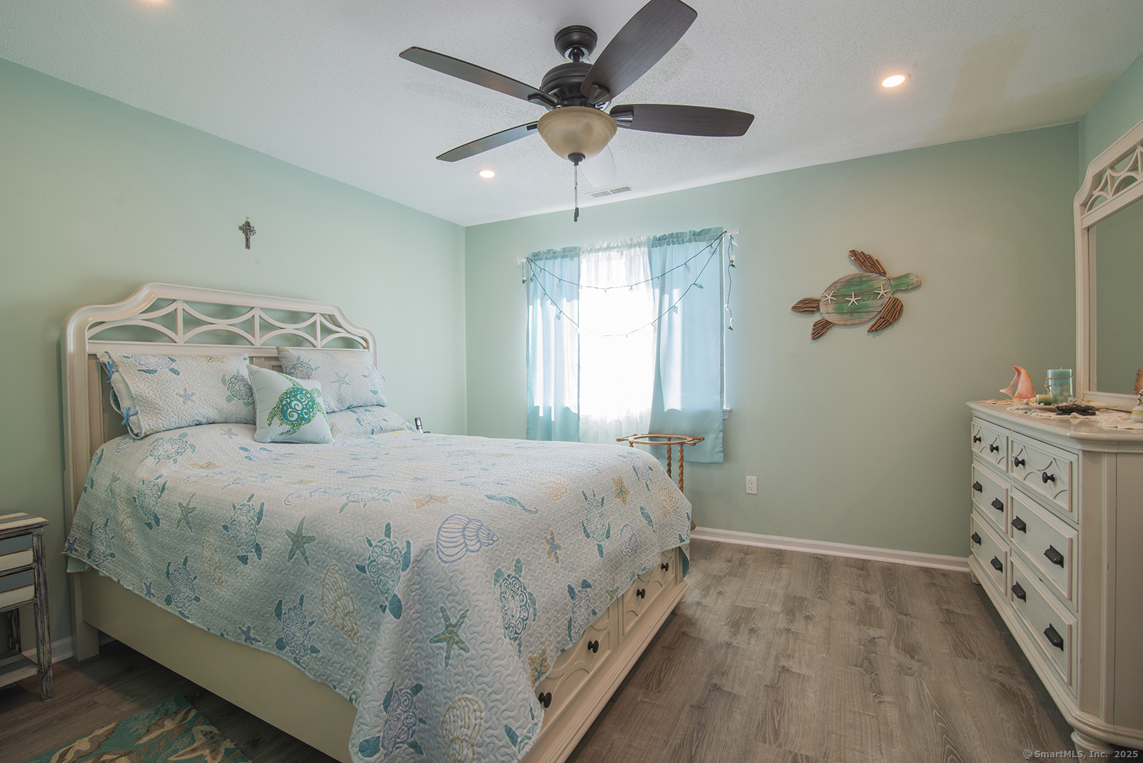 1 Mansfield Grove Road, Unit 306 East Haven, CT 06512 - Photo 19 of 31 a bedroom with a bed and a chandelier