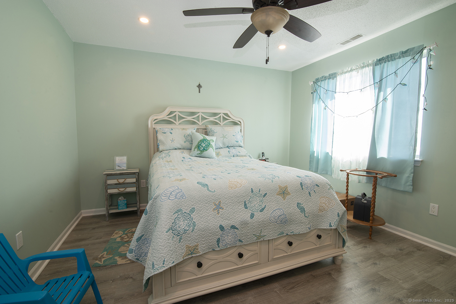 1 Mansfield Grove Road, Unit 306 East Haven, CT 06512 - Photo 20 of 31 a bedroom with a bed and a chandelier