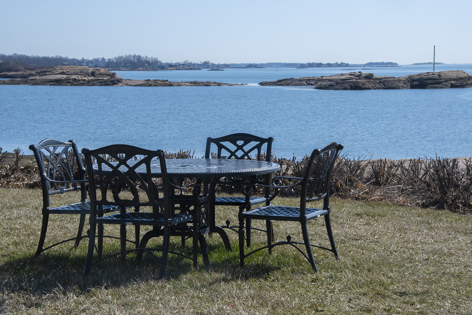 1 Mansfield Grove Road, Unit 306 East Haven, CT 06512 - Photo 27 of 31 a view of a chairs and table on wooden floor and lake view